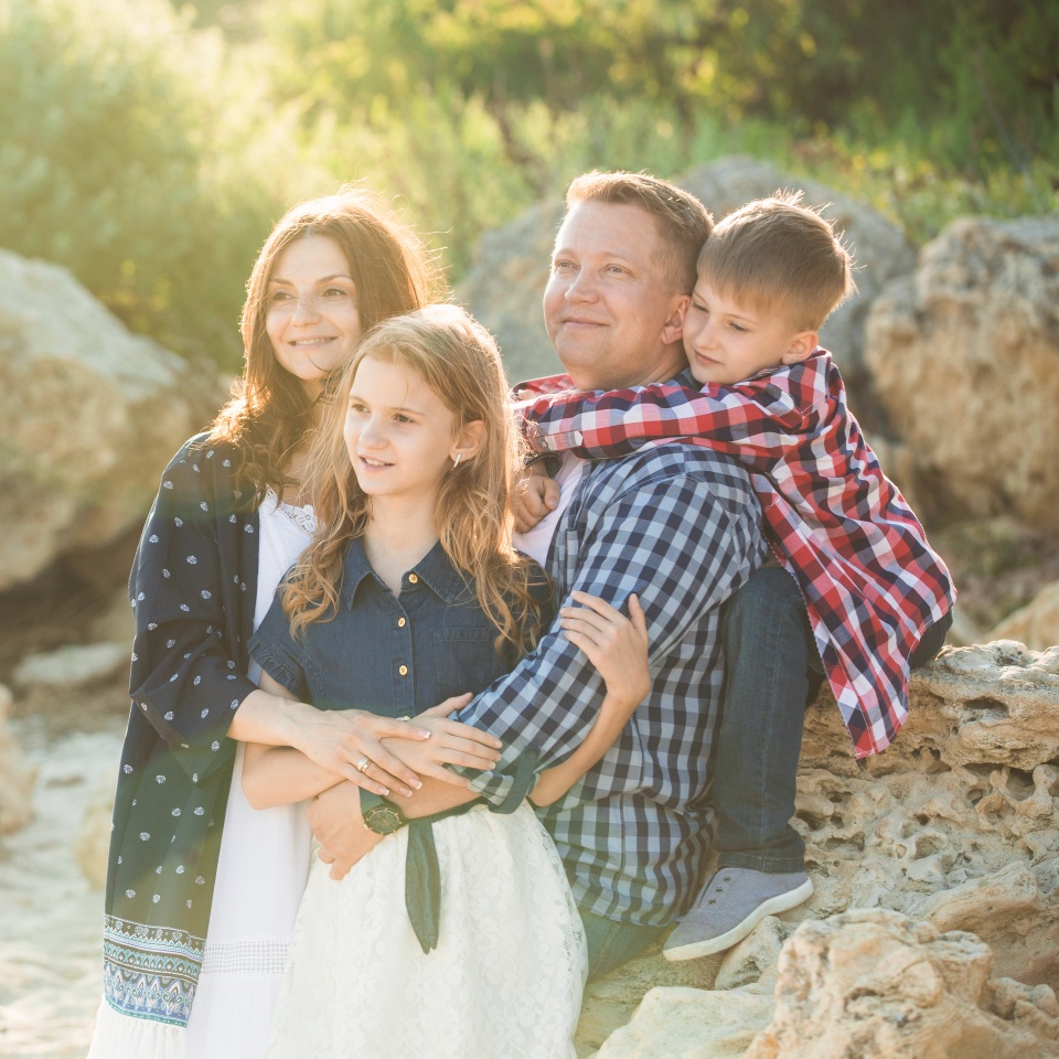 Father mother daughter and son. Family walking in national park