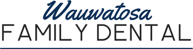 Wauwatosa Family Dental logo with "Wauwatosa" in cursive blue font above "Family Dental" in uppercase black letters.
