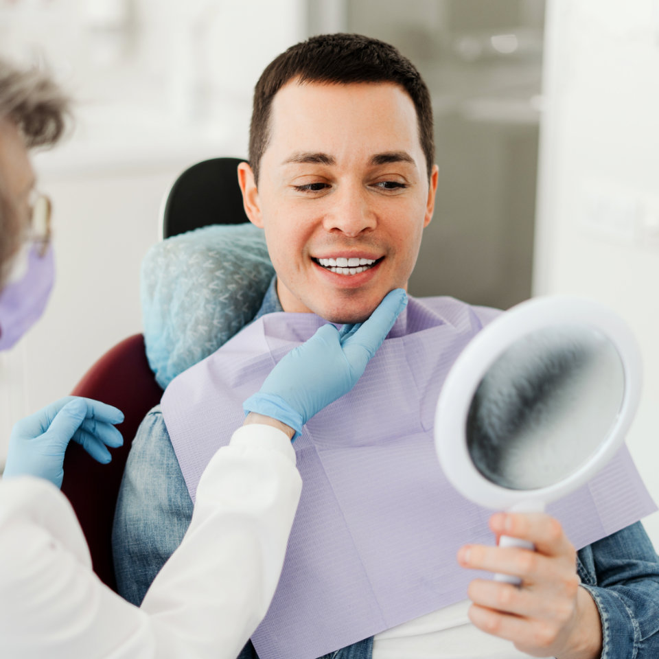 dental patient looking at the mirror