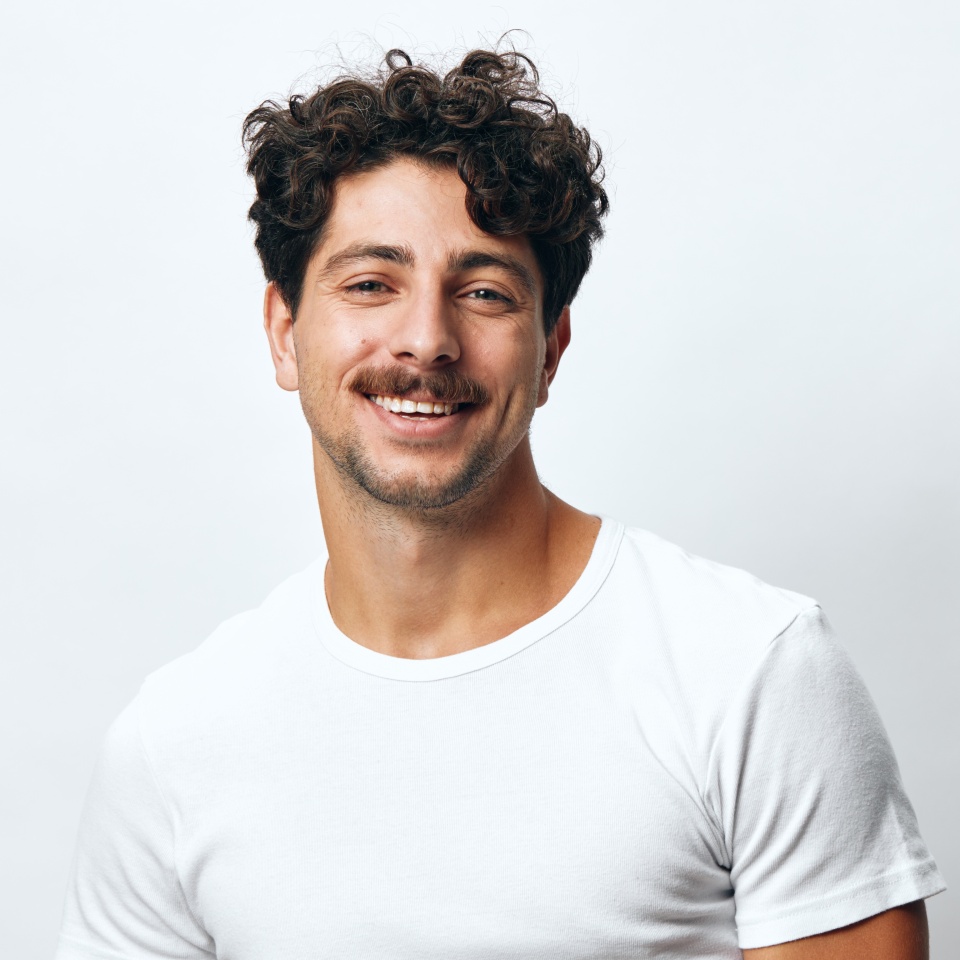 Smile man lifestyle standing t-shirt white portrait isolated background student fashion person serious hipster